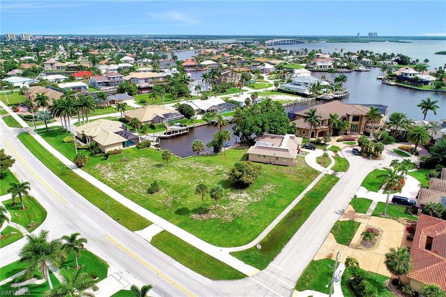 Oversize corner direct access home-site ready to build on. Tranquil long water and bay views. Premier location for avid fisherman and boaters with just a few minutes by boat out to the Marco River, Gulf of Mexico and Ten Thousand Islands. Close to the Island Country Club. Endless possibilities to design a world-class estate on .38 acres.