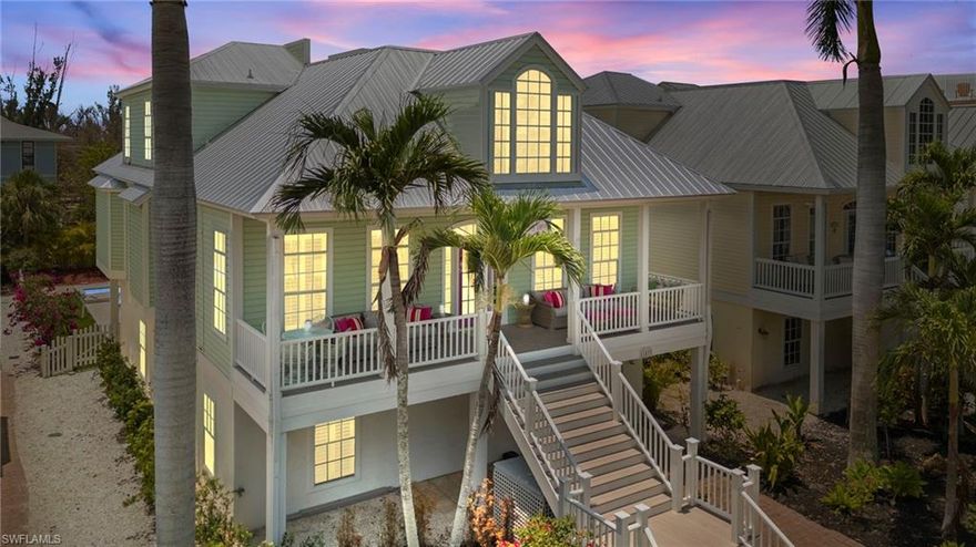 Village By the Sea is a small enclave of seven custom homes nestled in the Heart of Captiva's "Village" and just steps from the beach. Enjoy Olde Florida architecture including a lovely front porch with partial Gulf Views, hard wood floors throughout, volume ceilings, open floor plan and a new metal roof 2025. The great room offers a wonderful gathering place for family and friends and an updated/refurbished gas fireplace. Wonderful kitchen with new LG Stainless Steel appliances, Corian counters and everything you need and want to entertain. Enjoy a large dining table and family room for gathering around the activities in the kitchen that opens to a spacious screen enclosed lanai overlooking the completely refurbished/new heated pool, spa and surrounding deck. The primary suite sits on the main living level and has plenty of space including a sitting/office area, a built-in make-up vanity and opens to the screen enclosed lanai. The primary bathroom has a glass shower, whirlpool tub, double sinks and a walk-in closet. The split floor plan allows privacy for family and guests and 2 second floor bedroom ensuites that share a private sundeck overlooking the backyard and pool area. This home is being sold fully furnished and turnkey. Take a short stroll to the beach to enjoy fantastic shelling, sugar sand beaches and spectacular sunsets. Living in the Village puts everything you need and want just steps away, great restaurants including the Mucky Duck, shopping, Bailey's Island store and night time entertainment. Captiva island is rich in history and family traditions. This house has been lovingly used mainly by family and friends. Rented minimally.