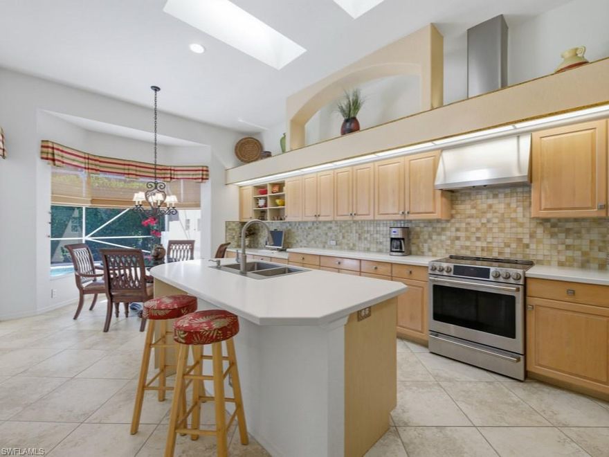 Elegant free-standing detached villa home with a uniquely private & serene pool area. The large kitchen boasts a spacious pantry and cabinets galore. There is a gorgeous Italian tile backsplash surrounding the countertops and stainless-steel appliances. The large eat in area is surrounded by lovely bay window that offers a great view of the impressive swimming pool. This is true swimmers pool! The large main suite has a grand feel to it, and offers large windows, overlooking a quaint courtyard that offers complete privacy. The double entry walk-in closet is outfitted with beautiful custom shelving The large owner's bath is naturally lit by large skylights. The second bedroom is a full ensuite including a walk-in closet. The den/study functions as a perfect flex room, with plenty of room for a sofa or pullout bed. There is an adjacent FULL bath and therefore can serve as an additional sleeping space for occasional guests. The garage has ample space for two cars and a golf cart  that can enter through it's very own dedicated bay.  The garage also has plenty of room for overhead storage. This is a must-see property. Enjoy an active country club lifestyle, complete with 3 beautifully maintained 9-hole golf courses, tennis, pickleball, all new state of the art fitness center, an impressive pool with lap lanes, newer bocce courts, as well as a recently added croquet center and Island Bar for residents to enjoy. The recently renovated main clubhouse next door to the Jr. Olympic pool houses two upscale restaurants: Fine dining on the upper level, and the Tavern 59 restaurant opens into botanical garden/outdoor wedding venue location. The Strand is conveniently located within close proximity to many dining/shopping options, and the famous sugar sand beaches of the Gulf are just a straight shot down Immokalee Rd.