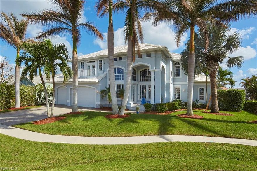 Stunning wide water views and intersecting canals. Open layout with spacious dining area and living room, bar and surround sound, open to the kitchen and breakfast nook. First-floor master bedroom suite, laundry and powder room. Sliding doors to screened lanai with dining area, plus pool with waterfall spa, pool bath. Paver walkways, lift, and amazing 1,905-square-foot dock with a glassed-in viewing area; what a fantastic entertainment area. Two stories plus a 3rd-floor observation deck. Entering the residence, the view of the 1st floor great room, wide water ways, lanai and entertainment areas are very impressive. Staircase with access to the 2nd-floor open family room with balcony. 2nd master bedroom suite, 2 guest bedrooms with en-suite bath and two balconies to observe Marco Island’s famous sunrises and sunsets. Third-floor observation deck, a great way to relax and take in fantastic water views. Watch the fireworks on the 4th of July from your home. This home is 0.8 miles to Resident's Beach and all it has to offer. There is no better way to love where you live. Great Marco Island lifestyle  with various dining options, white-sand beaches and beautiful turquoise Gulf waters.