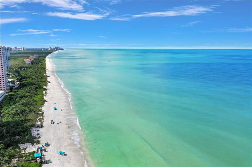 C.17589 - From the moment you step from your private elevator into this rare JEWEL and cast your eyes on the unobstructed mesmerizing, 180-degree panoramic turquoise Gulf waters, your soul knows you’re home. Dig your feet into Naples’ sugar white sandy beach for strolls at sunrise, sunset, or a blissful Gulf dip. Located on the perfect floor, this gem offers generous interior Gulf-Front living, along with two incredibly spacious screened Lanais, one for daily beachfront basking, the second for sunrise & coffee. Enjoy a level of personal concierge services anticipated from a Tower of this stature, complimented by direct Ritz access, as you reside smack-dab between The Naples Ritz Carlton Hotel and private Bay Colony Beach Club. It’s overdue time to play, right? Don’t forget the exceptional World Class menu of included Bay Colony membership privileges: 2½ miles of sugar sand beach, 3 Gulf-Front Beach Clubs with open air, casual, or more formal indoor dining, attended beach services, 3 active tennis centers, state-of-the-art fitness, life-long learning center, canoeing, kayaking+miles of walking, biking, and nature paths. You deserve to live your dream & this special JEWEL awaits you.