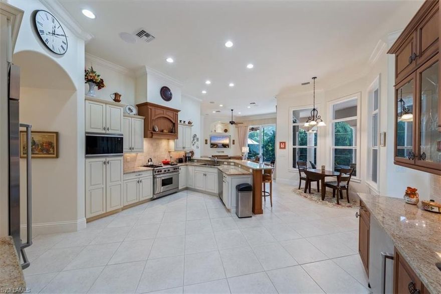 H7376 - Wonderfully appointed spacious home in desirable Castlewood at Imperial.  This home has an exceptional kitchen with high end appliances, gas cook top, and separate butler's pantry with beverage cooler and ice maker.  Open floor plan and tremendous architectural details that any designer will love. The disappearing corner sliders open 2 walls of the family room to the huge lanai.  A salt water pool and spill over spa have both solar and electric heat. A gas burning fireplace adds warmth on a chilly winter evening. There is a built-in summer kitchen tucked out of the way and perfect for entertaining. The master suite has 2 large walk-in closets and a spacious bath with dual sinks, walk-in shower & soaking tub. The guest wing is nicely appointed & has a large bath with soaking tub, beautiful cabinetry and granite. There is an office that could be a 4th bedroom w/ wood look tile floors. An other bath for dinner guest also serves the lanai.  This is a special home. All Impact windows and doors and a partial home generator make this fully storm ready.  Imperial is perfectly located close to Mercato, fine & casual dining and the beaches.  Imperial Golf Club membership is optional.