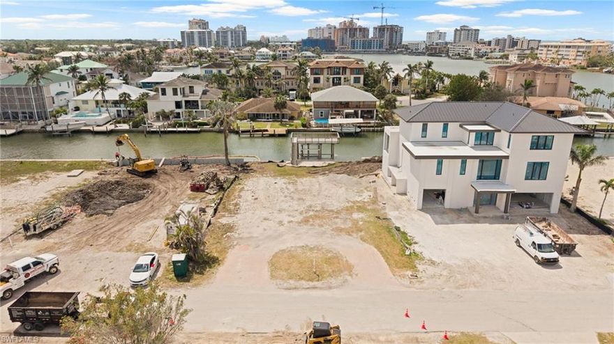 SOUTHERN EXPOSURE with grandfathered boat house! Discover the perfect site for your dream home in the coveted, no-fee community of Conners at Vanderbilt Beach. This rarely available cleared lot is ready for development, offering an idyllic setting for those seeking a serene waterfront lifestyle. 

This property is a boater's paradise, providing access to the Gulf of Mexico just minutes away. A grandfathered-in deck above the dock offers a unique vantage point for watching boats drift by and enjoying breathtaking sunsets over the horizon.

Located within a short biking distance to the vibrant Mercato shops, you'll have convenient access to a variety of shopping, dining, and entertainment options. The Waterside Shops are also close by, while the renowned downtown 5th Ave. South and 3rd St. South are just a short drive away, offering even more possibilities for leisure and exploration.

Don't miss this exceptional opportunity to build your custom home in an outstanding location that harmoniously blends the allure of Florida's waterfront living with an active, urban lifestyle. BUILDERS AVAILABLE UPON REQUEST.