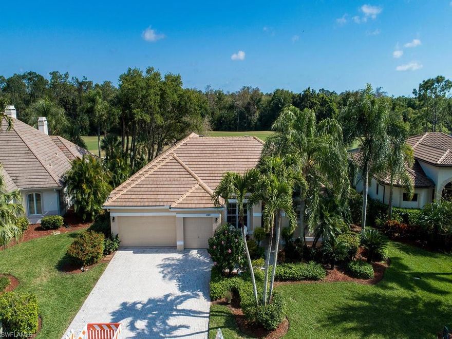 PRICE ADJUSTMENT This exceptional home is located in prestigious Lely Resort viewing the golf course.  The home features4 BEDROOMS, 3 BATHS PLUS A FAMILY ROOM with a formal dining room and a spacious living room.  A huge walk-in closet with two entrances ( A His/ Her) The kitchen offers many cabinets and a build in desk.  The view from the kitchen, eating area and family room are looking over the pool  with a running fountain and a view of the 7rh fairway on the Flamingo golf course and a wooded area.  Trees are along the side of the pool area offering much privacy.  New roof, Newly painted on the outside, new gutters.  THREE CAR garage floor and walls recently painted,  electric hurricane shutters along pool area and front windows. New hurricane storm windows installed on the guest bedrooms side, rain water gauge, surge protector, hot water heater only a few years old.   Very low HOA fees.  Conveniently located in the Naples area where all the amenities are available for your enjoyment.  A Must See.