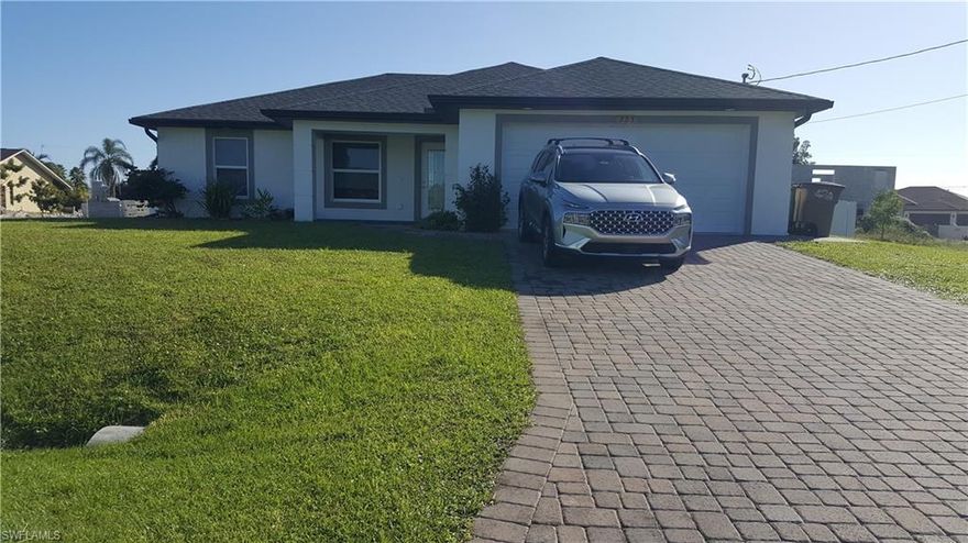2018 House , new pool, tiled floors, impact doors and windows, huge paved patio, fenced, city water and sewer. White cabinets and kitchen island.