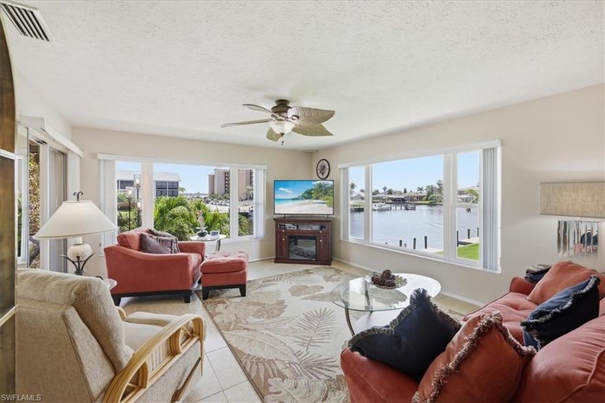 Experience the best of Florida Waterfront living in this beautifully updated corner-unit condo offering direct access to the river, an assigned boat slip, and your own private 10,000# lift—perfect for boaters seeking convenience and quick open-water access.  Positioned to capture expansive water views, this residence is flooded with natural light thanks to its premium SE corner location. Hurricane Impact Windows & Electric Hurricane Roll Down Screens on your balcony provides peace of mind. The active residents of this 55+ Community enjoy a waterfront Heated Pool with plenty of seating & loungers.  *The remaining 2026 Condo Fees are paid for You*  
Interior Highlights *Updated kitchen featuring quartz countertops and shaker-style cabinetry & pantry*Spacious private guest suite*Large in-unit laundry room with impressive storage capacity.  The light & bright  open living areas are  designed to maximize your water views from almost every room. For your convenience, a dedicated covered parking space and storage closet are right out your front door. The ever popular Beach Parkway area of Cape Coral offers walkable access & bike paths to Recreation & Entertainment.  Don’t spend another Winter in the Cold.