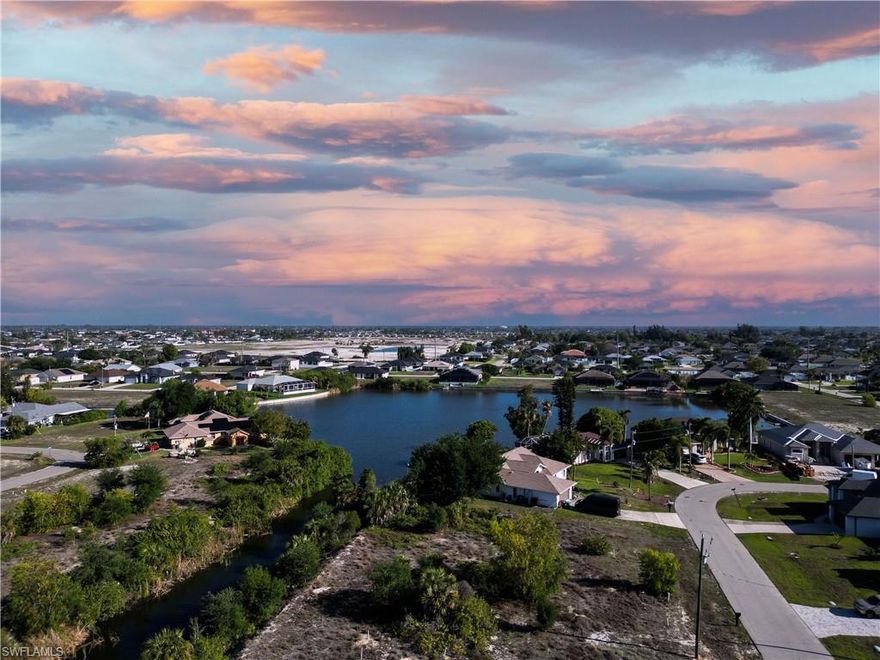 This freshwater lot in Southwest Cape Coral is located at 138 SW 9th Pl, near Nelson Rd and Embers Pkwy, offering convenient access to shopping, dining, and everyday essentials. Situated on the Sanibel Canal with access to Sidon Lake, the property provides a scenic waterfront setting with approximately 122 feet of water frontage. The lot is approximately 0.27 acres (about 11,770 sq. ft.) and is located in North 2, with city water and sewer utilities on street. Enjoy desirable western exposure, delivering beautiful sunset views each evening. Protective wildlife, is in the area. Zoned R1 for single-family residential use. A great opportunity in a growing area with easy access to everything Southwest Cape Coral has to offer.