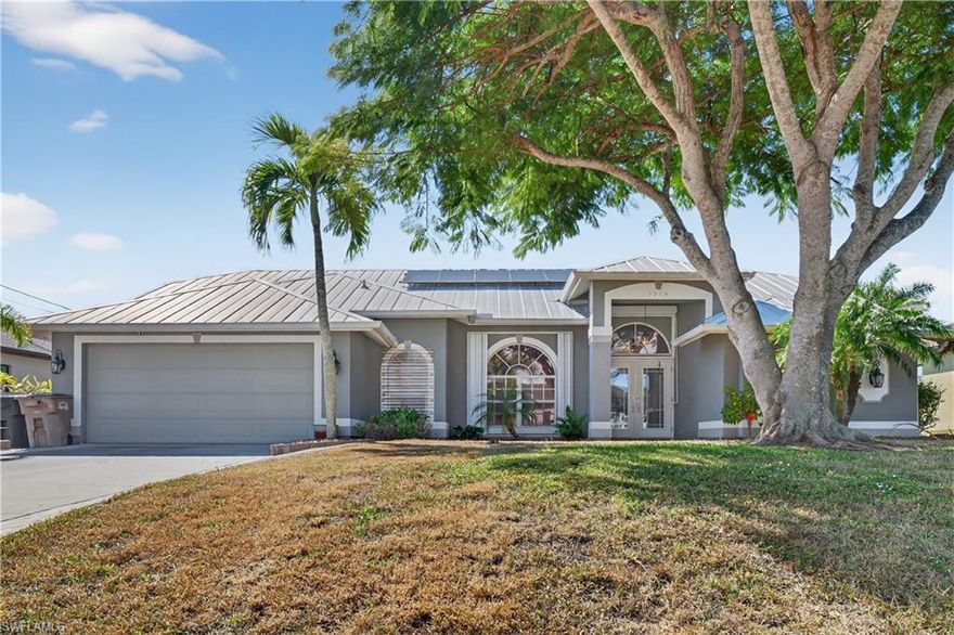 Coastal Entertainer's Dream! Imagine ending every day with vibrant Southwest Florida sunsets reflecting off intersecting Gulf-access canals—then hopping in your boat for an effortless cruise to Matlacha, the Gulf, or nearby islands. This exceptional waterfront home delivers the lifestyle buyers move to Cape Coral for.
Built for peace of mind and effortless entertaining, the home features solar panels, a whole-home generator, hydraulic lift foundation, and metal roof—rare upgrades that set it apart. Outside, a resort-style saltwater pool and spa anchor an expansive outdoor kitchen complete with a Memphis built-in grill, keg-a-rator, and ice maker, making weekend gatherings unforgettable.
Inside, the open split-bedroom layout offers both comfort and privacy. The updated kitchen shines with quartzite countertops, custom cabinetry, a built-in pantry, pot filler, and dedicated coffee station—designed for both everyday living and hosting. The primary suite feels like a private retreat with triple pocket sliders, dual custom walk-in closets, and a spa-inspired bath.
Located in a high-and-dry neighborhood with easy access to Burnt Store Road, this home has no history of flooding and offers the perfect blend of waterfront adventure, modern luxury, and everyday ease.