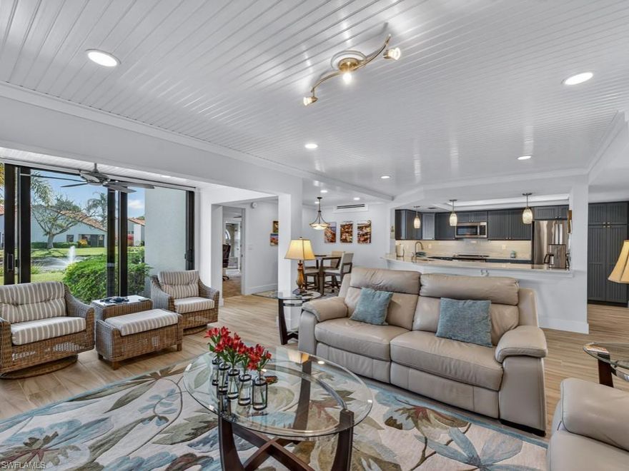 Beachwalk Community is a quiet peaceful and lushly landscaped enclave with desirable west of US 41 location. Walk, bike or drive to Gulf of Mexico and Vanderbilt Beach. Spacious 2 br 2 ba beautifully renovated condo (2022) with serene garden, lake and fountain views. All new PEX Piping! New AC (2025). Impact sliders floor to ceiling with lots of light in living / dining.  Plantation Shutters. No stairs, ground floor unit with large tiled patio. Convenient carport space directly in front. Beachwalk Gardens Condo Association. Roofs were replaced in 2022. Buildings Painted in 2023. Short distance to the Beachwalk Community Clubhouse, 2 community pools, spa, fitness, 6 lighted tennis courts with active program. Secured with 24 hour manned gated entry. Convenient to restaurants, shopping, entertainment at nearby Mercado, Pavillion and Publix anchored neighborhood center. Across Vanderbilt Beach Road is Pelican Bay Community Park with an array of Pickleball Courts! Close by are Vanderbilt Beach access and public parking. Plenty of Beach front restaurants along Gulf Shore Dr. with wonderous sunsets. Lead the amazing Naples lifestyle at Beachwalk!