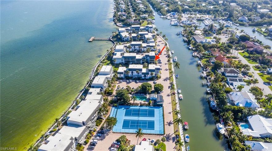 It’s your entry into the carefree world of fun and leisure in this immaculate, beautifully furnished 2 bedroom/2 bath impressive end unit condo set on a seven-acre finger of land between San Carlos Bay and the East End canal system of Sanibel Island.  Condo boasts updated kitchen and baths, impact sliders that welcome sunshine, and enclosed porch area with views of bay and canal.  Mariner Pointe Community has all the amenities of a fine resort and offers you the opportunity for a lifestyle you have dreamed about.  Amenities include deeded beach access, 2 heated pools, 2 all-weather tennis courts, pickleball, private fishing pier, BBQ grills, shuffleboard, kayak launch pad, storage, boat dockage available with water & electric, bayside boardwalk and on-site maintenance manager.  Everything you want – Even if you want everything!  MAKE SURE TO VIEW THE OPEN HOUSE VIRTUAL TOUR!!