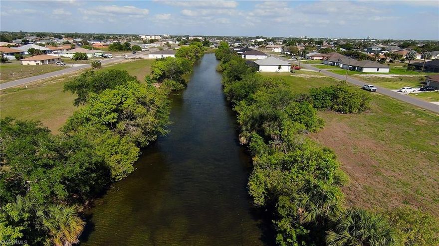 Rare opportunity to own two adjacent homesites at 1109 NE 15th Terrace and 1105 NE 15th Terrace, offering nearly ½ acre of combined land (approximately 0.46 acres) on a beautiful freshwater canal in a desirable and growing area. Build your dream 4,500+ sq ft custom home with a 3-car garage and still enjoy a generous outdoor living space, perfect for a pool, outdoor kitchen, or extended entertaining area with serene water views. Purchasing both lots together provides exceptional flexibility, privacy, and a premium waterfront setting that a single lot simply cannot match. Located in a rapidly developing area with new construction nearby, this is a unique chance to secure a larger waterfront footprint in paradise, ideal for those looking to create a one-of-a-kind residence.  Don’t miss this exceptional double-lot waterfront opportunity!