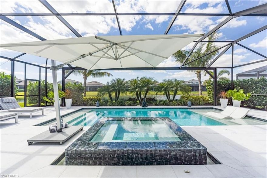 Welcome to the epitome of luxury living in this spectacular Pallazio floor plan home, boasting 4 bedrooms plus a den and 3 bathrooms. As you enter the stunning custom iron and glass entry, you're greeted by an inviting central common area that effortlessly combines the great room, kitchen, and dining area. The great room exudes elegance with its sophisticated tray ceiling and vertical shiplap feature wall, creating a refined ambiance perfect for entertaining or simply unwinding after a long day. The gourmet kitchen is a chef's delight, featuring an oversized island with a veggie sink and breakfast bar, top of the line stainless steel appliances, walk in pantry, and abundant cabinetry and countertops providing ample storage and prep space. The primary suite provides a peaceful sanctuary with its spacious bedroom, tray ceiling and bay window while the ensuite bath offers a a spa-like retreat with dual sinks, a large glass walk-in shower with multiple showerheads, and a private water closet. Your visiting guests will feel pampered in the three additional bedrooms, one of which features a private full bath, providing convenience and privacy for all. Seamless indoor/outdoor living is achieved on the expansive screened lanai, accessible through disappearing sliding glass doors from both the kitchen and great room. This outdoor oasis features a full outdoor kitchen and sitting area, perfect for al fresco dining and entertaining. Take a dip in the custom gas heated, saltwater pool and spa by Aragon Pools, complete with a sun shelf for lounging in the Florida sunshine. Electric rolldown sunscreen shades ensure comfort and privacy, while a picture window screen offers uninterrupted views of stunning sunsets and tranquil water vistas. Additional features abound in this exquisite home, including easy maintenance luxury vinyl plank flooring, designer lighting, Kinetico water system, Sonos sound system, automatic outdoor lights, outdoor camera system, lush landscaping, epoxy floor finish with storage system in the garage as well as an insulated garage door. Conveniently located just a short distance from amenities and on-site dining, this home offers the perfect blend of luxury, comfort, and convenience, making it a true gem in the sought-after gated community of Esplanade Lake Club. The Club community spans 779 acres positioned around a 352-acre lake. Amenities include a Bahama Bar and Grille, full-service tennis facility as well as pickleball and bocce courts, Lifestyle Manager, resort pool, full service spa, state of the art fitness center, community boat ramp, kayak launch, lakefront beach area, dog park & nature trails.