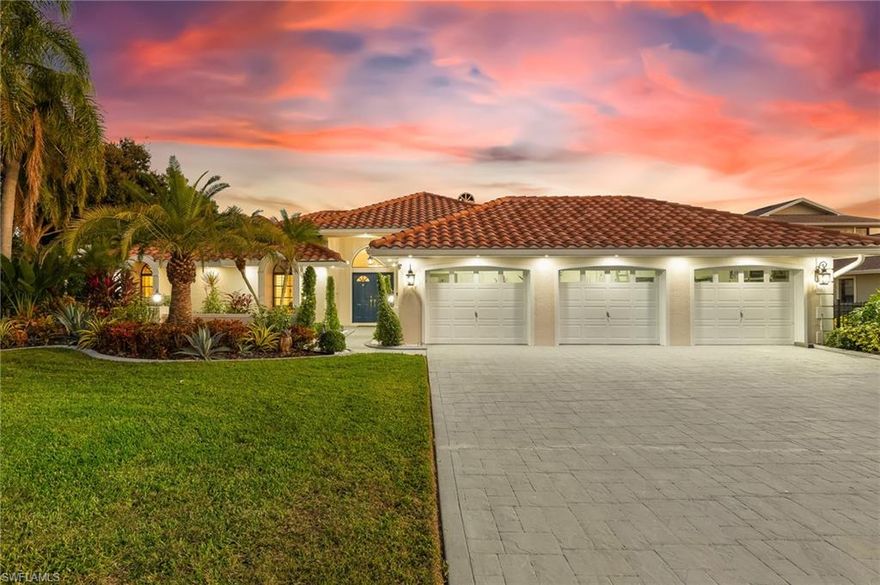 Introducing a rare and exceptional triple-lot masterpiece with direct Gulf access! Experience the pinnacle of sophisticated coastal living in this beautifully reinvented Floridian escape, ideally situated in the highly coveted Gold Coast Estates. Crafted for the refined homeowner and enthusiastic boater, this residence showcases one of the most desirable south-facing exposures—just minutes from open water—offering effortless Gulf access and sun-drenched outdoor living.
Step inside to a stunning blend of luxury and comfort, where soaring ceilings and marble-inspired porcelain floors flow gracefully through sunlit, open-concept spaces. Newly updated with brand-new quartz countertops, premium appliances, and modern cabinetry, the chef’s kitchen provides the perfect balance of elegance and function. A dedicated kitchen slider seamlessly connects indoor culinary spaces with the outdoors, encouraging year-round dining and effortless entertaining.

The expansive living room, enriched by walls of glass and sliders, transitions flawlessly onto a gorgeous paved lanai and pool deck. Here, a freshly tiled, heated pool and spa are embraced by lush, professionally curated tropical landscaping, establishing a serene, resort-style ambience. Along the side of the home, a spacious newly paved entertainment terrace provides the perfect space for grilling, gathering, and enjoying the coastal breeze.
The master suite offers a peaceful retreat, accentuated by beautiful windows that welcome soft sunlight and frame picturesque water views. The spa-inspired ensuite showcases a freestanding soaking tub, a walk-in shower, and dual vanities—creating a refined oasis dedicated to comfort and relaxation.
For boating enthusiasts, the waterfront amenities are truly exceptional. In addition to expansive composite decking stretching across much of the 125’ seawall, the property includes a 15,000 lb boat lift and a 7,000 lb boat lift, providing unmatched versatility and convenience for multiple vessels.
This home is enhanced by a collection of premium upgrades that elevate both luxury and functionality:
 *Electric shutters for peace of mind
 *Electric blinds and plantation shutters for refined, effortless light control
 *Surround sound (Sonos) and TVs with Bose audio for immersive entertainment
 *Under-lighting in the fascia for stunning nighttime ambiance
 *Epoxy-finished three-car garage with backyard access
 *Avocado and mango trees, adding charm and fresh tropical flavor to the landscape
 *New pavers surrounding the back and sides of the home for pristine presentation and durability

Set on a fully fenced triple lot and surrounded by vibrant tropical foliage, this property exudes privacy, beauty, and coastal sophistication. Pairing convenience with tranquility, it sits moments from essential amenities while maintaining the serene ambiance of waterfront living. Set up your private viewing today, and embrace the elevated lifestyle of true Gulf Coast living today!