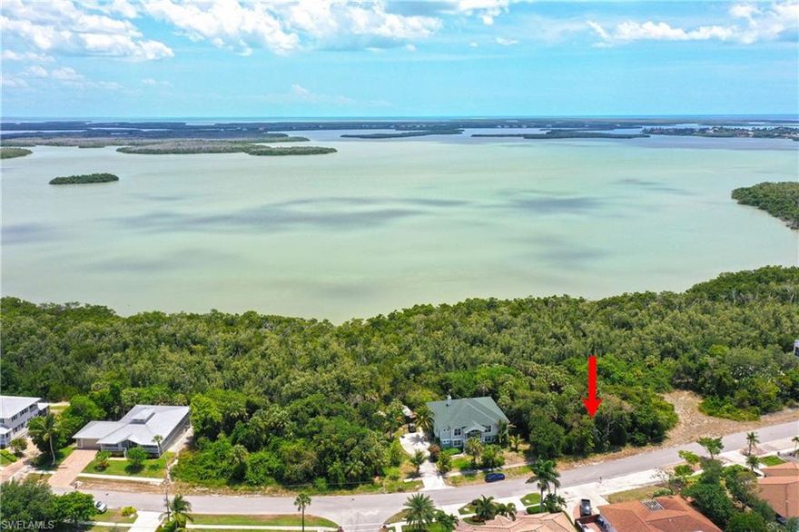 Build your home on this quiet street close to shopping and restaurants.  This lot includes the small parcel in the rear as part of the sale, property ID 57200890005.  Sewer assessment paid.  Possible views of Barfiled Bay from an elevated home design.