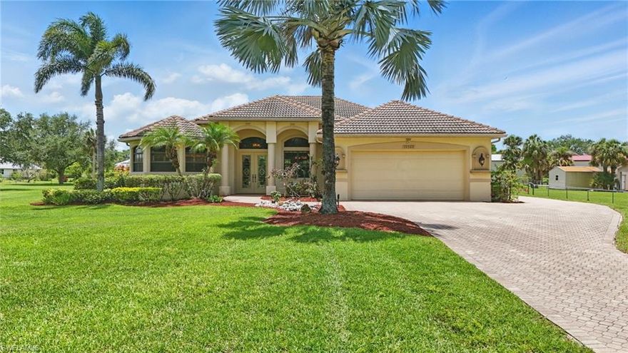 Nestled in the heart of Pristine Old Olga, this beautifully maintained 3-bedroom, 2-bathroom home is set on a picturesque 1-acre lot, offering peace of mind with its location outside of any flood zone. Step into the grand living room, where soaring vaulted ceilings, custom built-ins, and integrated surround sound create an inviting atmosphere that extends throughout the home. The chef’s kitchen is a culinary dream, featuring granite countertops, a gas cooktop, a built-in wine cooler, and a generous island—perfect for entertaining. Adjacent, the formal dining room sets the stage for memorable gatherings.The primary suite is a serene retreat, offering two spacious walk-in closets and a tranquil escape at the end of the day. Two additional bedrooms provide flexibility for guests, family, or a home office.Additional highlights include hurricane-impact windows, a monitored security system, and a 2.5-car garage with built-in cabinetry, a dedicated workstation, and a separate golf cart entrance. Modern upgrades such as a whole-house Generac generator, a reverse osmosis water system, a new water heater, and a new pool pump enhance comfort and reliability. Outdoor living is elevated with a spacious screened lanai, featuring a summer kitchen and a heated pool and spa—ideal for year-round enjoyment.Located just minutes from the W.P. Franklin South Recreation Area, residents can indulge in a variety of outdoor activities, including hiking, fishing, picnicking, biking, horseback riding, and kayaking on the Caloosahatchee River. The area also offers a visitor center, playground, and boat ramp, providing endless opportunities for adventure and relaxation.