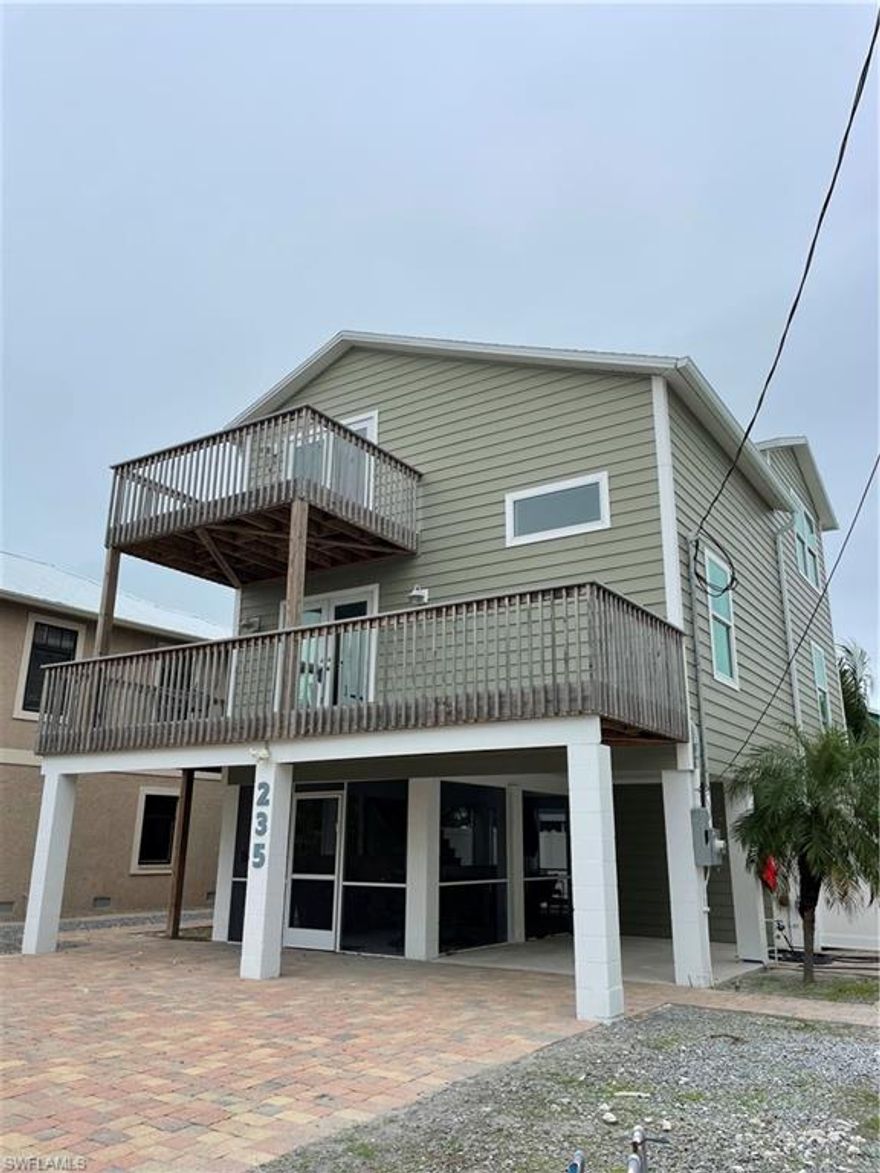 This house is just 5 minutes away from putting your toes in the sand. This stilt home has all new siding, compost decking, appliances, pool equipment, flooring, cabinets, along with hurricane impact doors and windows. The semi furnished three story home would make a great vacation rental located in the weekly rental zoning.  The location gives you many option to walk to restaurants and shopping. Your opportunity to own a piece of Paradise