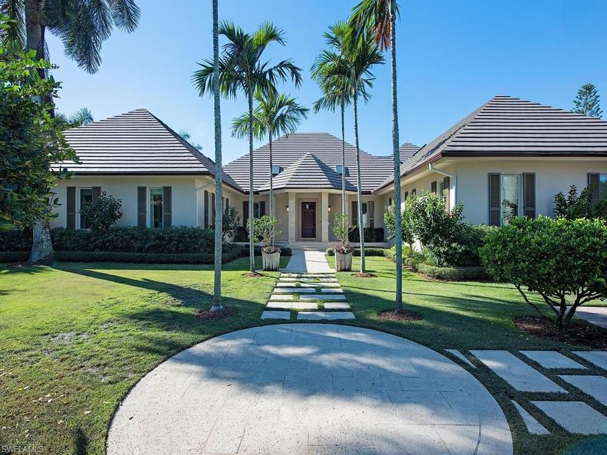 H.11452 - Elegant, timeless Port Royal 4 Bedroom + Den home on a lot and a half conveniently located close to the Port Royal Club.  Classic architecture is wrapped around by lush, beautifully manicured tropical environs to create a work of art.  The floorplan is open and sprawls across 6,942 Sq.ft. of living area.  Features include gorgeous custom millwork and stonework, marble flooring, newer concrete tile roof, 3 bay collector garage, large vaulted ceilings, gas fireplace, custom lighting, large wetbar area, VIP guest suite, multiple balconies, media/game room and much more.  Gourmet kitchen includes custom cabinetry, granite counters, large island with two sinks, wall oven and top of the line appliances.  Large master suite includes his and her walk-in closets and dressing room and lavish master bath.   The lanai space is perfect for entertaining with its pavilion overlooking the resort style pool and multiple covered relaxation spots.  Immediate eligibility to the Port Royal Club.