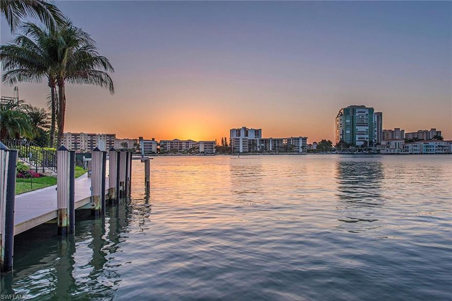 Breathtaking water views over Venetian Bay are abundant with over 170 feet on the water. This boater’s paradise provides large dock and lift, accompanied by a separate jet ski lift, offering endless hours of enjoyment opportunities. Entertain friends and family on land with ease, at the negative-edge pool and spa and full outdoor kitchen with built-in gas grill. Polished travertine flooring compliments the stone gas fireplace in the family room, while natural wood flooring highlights the open living room and kitchen featuring gas cooktop, Wolf convection double wall ovens, light granite countertops and breakfast bar. The spacious master suite with water views is a relaxing retreat with a spa-like master bath with walk-through shower and soaking tub. Owners will also enjoy the SONOS sound system, three-car garage, elevator and optional membership to the private Moorings Beach Park.