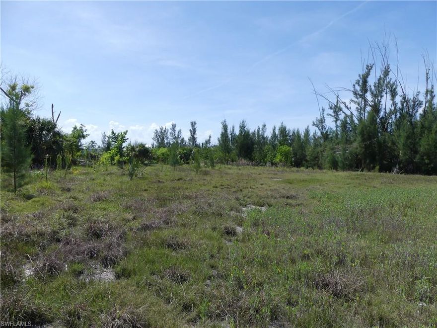 Cleared lot with view of the lake.  In the heart of St James City.  Walk, bike, or take your golf cart to all the events and restaurants in downtown St James City. Perfect location for your new Florida home.