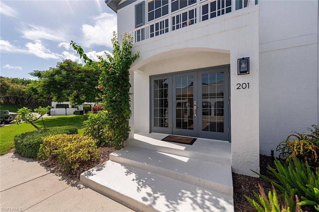 Photo of 864 TANBARK DR #201, NAPLES, FL 34108 (MLS # 225068288)