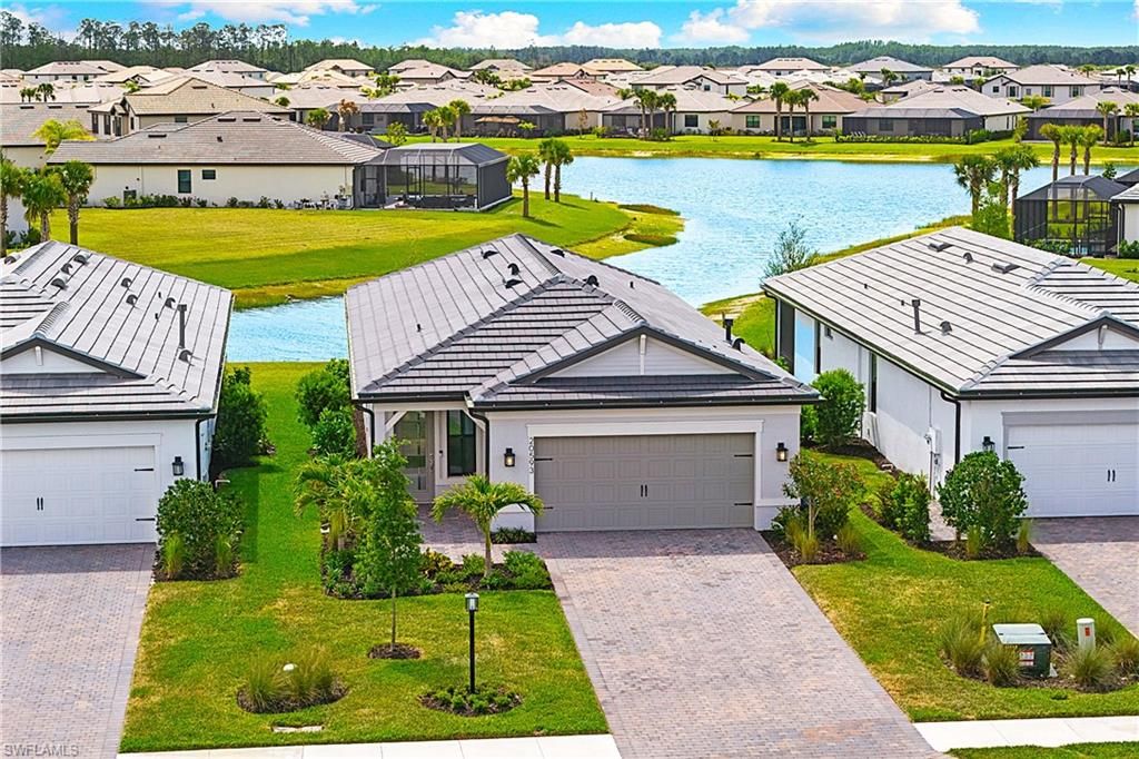 Photo of 20593 Pebble Glen DR, ESTERO, FL 33928 (MLS # 226016919)