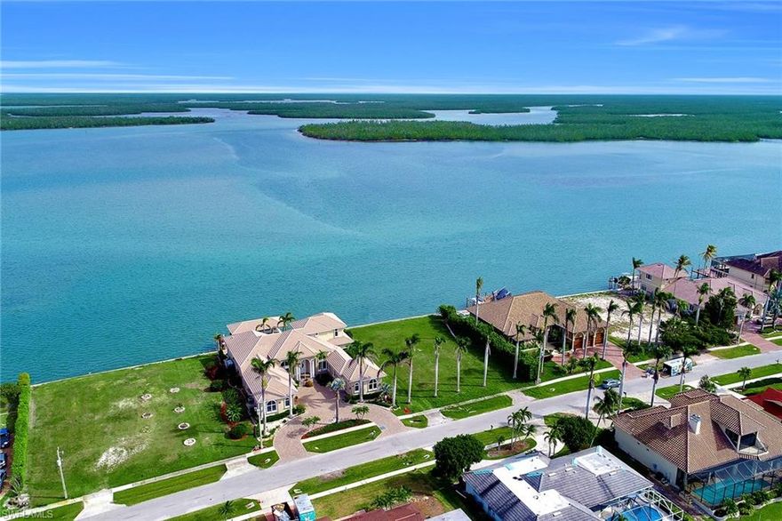 Build your custom design waterfront retreat on this over-sized home-site with incredible unobstructed wide water views of the Marco River. Just a few short minutes of water direct access to the Gulf of Mexico. Surrounded by newer luxurious homes. 150 feet deep allows for more construction variables. There are several large Royal Palms already located at the front of the property. Newer seawall installed in 2010. Don't miss this rare opportunity.