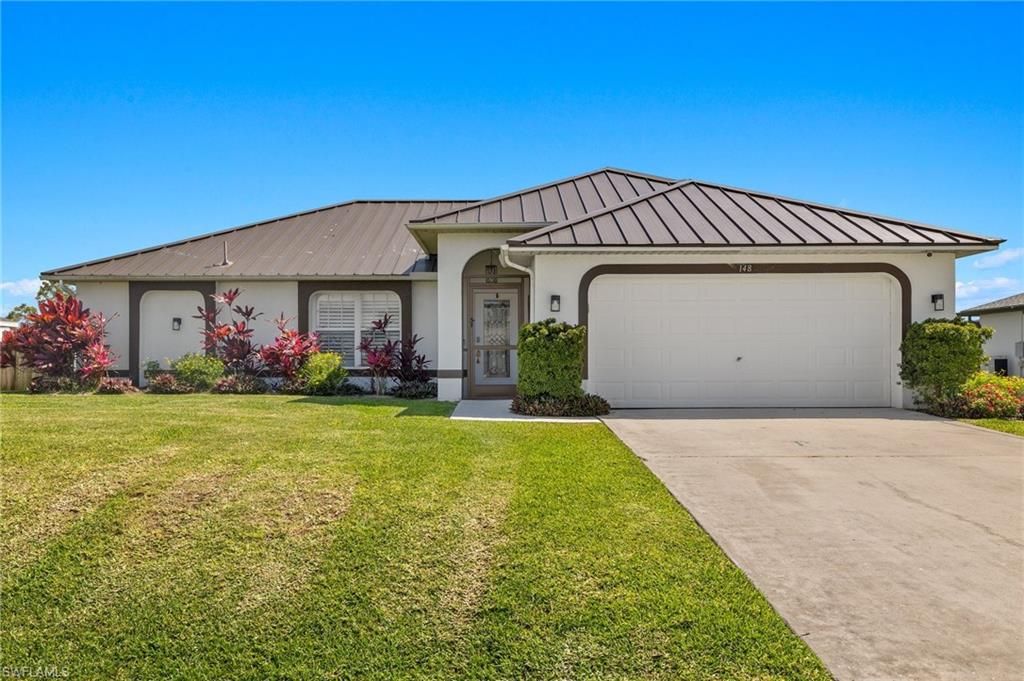 Photo of 148 SW 31st ST, CAPE CORAL, FL 33914 (MLS # 226019199)