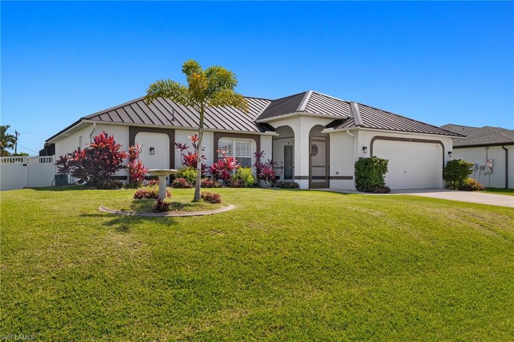 Photo of 148 SW 31st ST, CAPE CORAL, FL 33914 (MLS # 226019199)