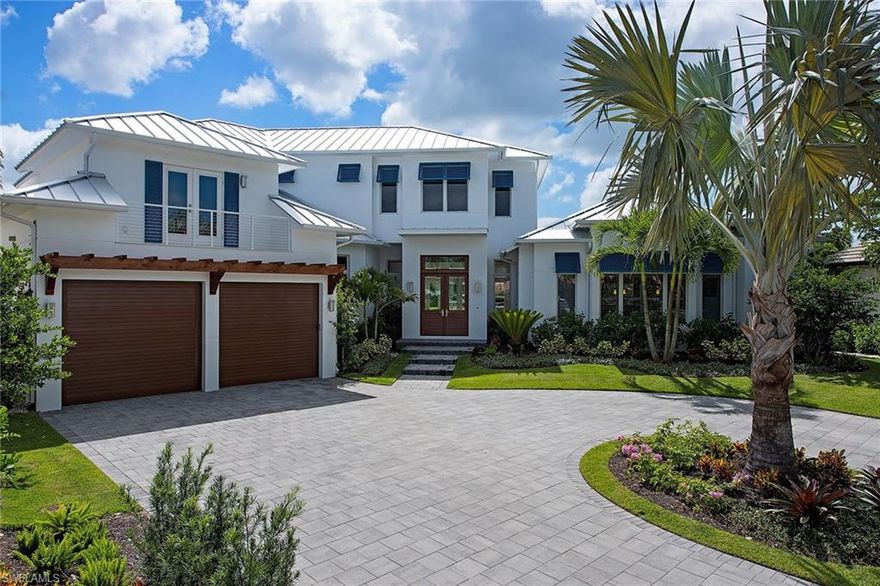 Now Complete!  Located on a desired cul-de-sac, with direct access to the waters of the Gulf of Mexico, sits a new custom home designed by Jon Kukk Architects. With a rare 188 feet of water frontage, this state-of-the-art home offers 5,538 square feet of open interiors with unmatched artisan quality finishes and luxury, four guest suites, a separate study and spacious sitting area. The gourmet kitchen offers the best in form and function, with large center island and professional-style appliances, water views and an easy transition to the covered exterior lanai area. The grand great room features a wall of floor-to-ceiling doors that open to the spectacular rear grounds, with infinity pool, grassy area and boat dock. Truly a well-designed architectural estate within an exclusive boating community.