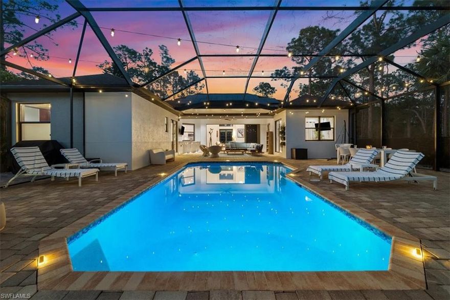 Welcome to your 1.14-acre modern oasis at 5858 Star Grass Lane. OFFERED FULLY INCLUSIVE: Rent covers electric, high-speed internet, water/sewer, trash, security system, landscaping, weekly pool service, pest control, and water system maintenance. This 4BR/2BA estate offers 2,432 sq. ft. of sleek living space featuring high ceilings and luxury vinyl floors. The newly remodeled chef’s kitchen flows into an open-concept living area with disappearing sliders that lead to a screened lanai and heated saltwater pool. A unique highlight is the 2-car garage, currently an air-conditioned rec room—ideal for a home gym or office—with an easy conversion back to a standard garage. The massive fenced property includes a trampoline, soccer goals, basketball hoop, and fire pit. Ideally located minutes from 64 pickleball courts at East Naples Community Park, championship golf, and pristine Gulf beaches. Experience maintenance-free luxury living in the heart of Naples. 1-year minimum lease.