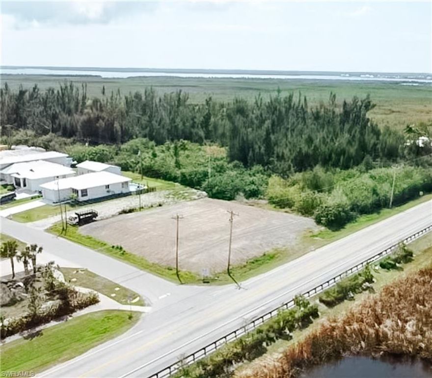Great investment and unique opportunity!! This lot is located in the Heart of Cape Coral but is a part of Unincorprated Lee County when it comes to Taxes and building requirements - which is unique to find.  This is a perfect spot to build your very own Mancave, Huge Garage with minimal living area or split the lot and build 2 Single Family Homes like some of the neighboring homes.  Currently it is zoned for Mobile homes and/or Single Family Zoning. The Lot has been completely filled bringing the elevation up to over 9' ($65,000 worth of value). The current owner has plans done for a Mancave style property - Huge Garage, with some living areas that they would be happy to provide the buyer. This property is near the Fast Developing Pine Island Rd/Veterans and Burnt Store Rd Corner, and Matlacha, providing a high traffic count. The possibilities for this parcel are numerous.
