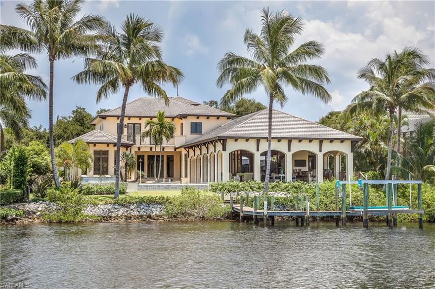 Truly a one-of-a kind, magnificent home located directly on the Imperial River in the Marina Pointe section of Bonita Bay.  Built by London Bay with exquisite quality materials and finishes throughout.  Private dock with direct Gulf access.  Infinity pool. Exquisite river views from within the home, surrounded by mature palm trees and landscaping, creating an environment of serenity and privacy.  A timeless, signature home.