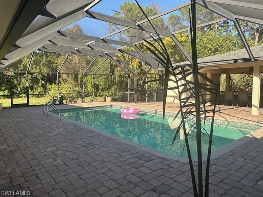 Photo of 1261 Pine Ridge RD, NAPLES, FL 34108 (MLS # 225084939)