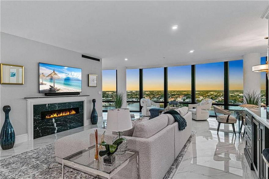 Positioned within Le Ciel Venetian Tower in prestigious Park Shore, this sophisticated residence showcases sweeping views of Venetian Bay, where mornings unfold in soft sunrise hues and evenings glow with the shimmer of city lights. Designed with elegance and intention, the two-bedroom plus den layout offers over 2,500 square feet and is furnished in refined luxury, featuring a comprehensive renovation distinguished by craftsmanship and attention to detail. The open kitchen centers around an impressive entertaining island, complemented by custom Conestoga cabinetry and state-of-the-art Miele appliances. Inalco tile flooring flows throughout, enhanced by designer lighting fixtures, a striking fireplace in the living room, custom window coverings, and impact-rated windows. The serene primary suite offers custom walk-in closets with dual wall safes and a spa-inspired bath, creating a retreat of comfort and style. Additional highlights include a whole-home water filtration system, one deeded parking space, and private storage. Residents of Le Ciel Venetian Tower enjoy gated entry, on-site management and security, a beachfront pool and spa, tennis courts, a fitness center with sauna and steam rooms, two guest suites, a social room, BBQ area, and direct beach access all just moments from The Village on Venetian Bay, the Park Shore Promenade, and the Venetian Bay Yacht Club.