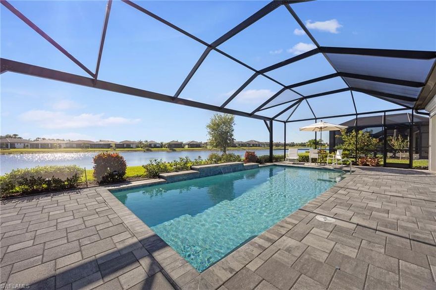 ***PRICE IMPROVEMENT!!*** Welcome to 6190 Nobility Way, a rare REVERENCE GRANDE in the GATED 55+ COMMUNITY of DEL WEBB NAPLES at Ave Maria, where SOPHISTICATED ENTERTAINING meets POOLSIDE ELEGANCE in an EXCEPTIONAL GOLF COMMUNITY SETTING. Offering 4 BR + DEN + LOFT, 4 FULL BATHS, and OVER 3,700 SQFT, this home is designed to host beautifully while still feeling open, relaxed, and effortless.

The heart of the home flows through TWO POCKET SLIDING GLASS DOORS to an EXTENDED COVERED LANAI and a SHOWPIECE 13’ x 28’ HEATED POOL with WATERFALL FEATURE, framed by EXPANSIVE DECKING and a PICTURE-FRAME SCREEN capturing PEACEFUL LAKE VIEWS. The outdoor space easily accommodates large gatherings, multiple seating areas, and elegant evening events, all enhanced by STORM SMART SCREENS for comfort and flexibility in any weather.

Inside, the home showcases ELEVATED FINISHES THROUGHOUT, including HAND-BLOWN MURANO GLASS PENDANTS FROM ITALY, a SWAROWSKI CRYSTAL CHANDELIER, BUILT-IN APPLIANCES, a vented hood, under-cabinet lighting, a WINE BAR SETUP, and additional recessed lighting in the gathering room, lanai, and loft. The first floor features TILE FLOORING, a GLASS ENTRY DOOR, BUILT-IN OFFICE SHELVING AND DESKS, upgraded showerheads, and abundant storage.

The layout is IDEAL FOR HOSTING GUESTS. BEDROOMS ARE POSITIONED SEPERATELY FROM THE PRIMARY SUITE, while the second floor offers a spacious loft, private bedroom, and full bath, creating a RETREAT-LIKE SPACE FOR VISITORS. For MULTI-GENERATIONAL LIVING, the STRAIGHT STAIRCASE CAN ACCOMODATE A STAIR LIFT, adding flexibility for LONG-TERM COMFORT.

The FURNITURE IS NEGOTIABLE for an EASY RELOCATION.

The home sits on an OVERSIZED LOT with a GREEN SPACE across the lake, and the GARAGE INCLUDES TWO CAR SPACES + GOLF CART BAY, EPOXY FLOORING, and ADDITIONAL STORAGE. IMPACT WINDOWS AND DOORS, 2 A/C UNITS, a CULLIGAN WATER CONDITIONING SYSTEM, and SMART LOCKS add convenience and peace of mind.

Beyond the home, Del Webb Naples delivers an ACTIVE, SOCIAL LIFESTYLE with OPTIONAL GOLF MEMBERSHIPS, RESORT & LAP POOLS, FITNESS CENTER, PICKLEBALL, TENNIS, BOCCE, CLUBS, LEAGUES, and activities led by a FULL-TIME LIFESTYLE DIRECTOR. This is a community built for connection as much as recreation.

Set within Ave Maria, a nationally recognized BLUE ZONE® and TOP U.S. MASTER-PLANNED COMMUNITY, residents enjoy a VIBRANT TOWN CENTER, DINING, EVENTS, PARKS, and AVE MARIA UNIVERSITY.

This is not just a home — it is a SETTING FOR CELEBRATIONS, CONNECTION, AND ELEVATED EVERYDAY LIVING.

Ave Maria: where community meets paradise.