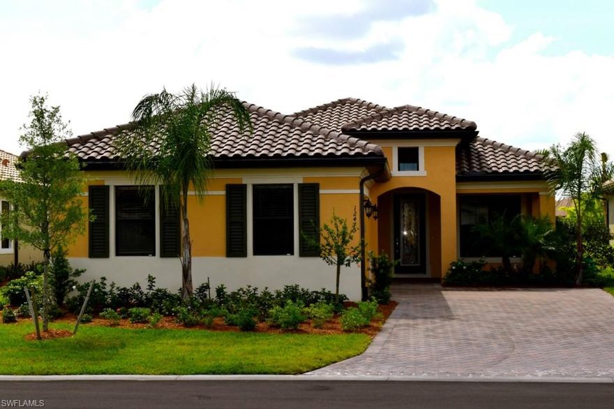 Seeing is believing: This beautifully appointed home is better than new! Custom blinds, ceiling fans, pool heater and more are already done. The popular Valencia design by WCI is known for its optimal use of space in key living areas. This fabulous south facing pool home overlooks a large serene lake. One of the many design features is the "open concept" living which flows seamlessly through the greatroom & 4 panel stacking 8' door system leading to the private & spacious outdoor living area. Modern design finishes such as wide floor tile & hardwood are complimented by the use of rich wood cabinetry and stone surfaces.  The latest rave in today's home designs is the oversized kitchen island which serves as the perfect centerpiece for entertaining. The private study with French doors is the perfect place to relax, update your social media & organize your upcoming activities. The guest room is located in a private area & is large enough for a king bed.  Hampton Park is located in highly sought after community of Gateway. There is a host of amenities that offers something for everyone. Schedule your showing soon as this is the only home available on this recently finished street.