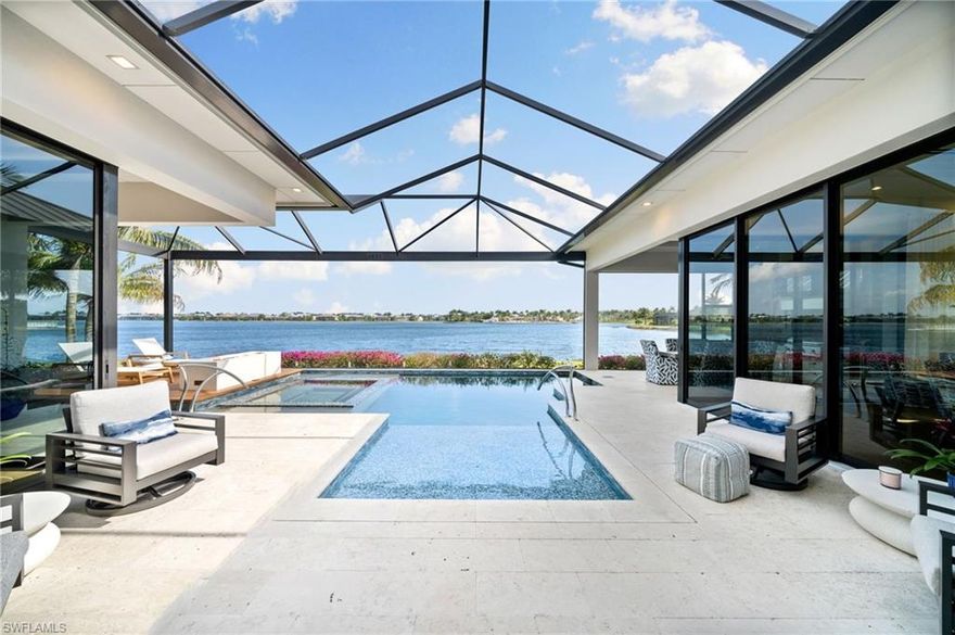 Elegance and luxury at its best awaits in this hidden gem. This private one of a kind turnkey furnished home is located on one of the most prestigious streets in Naples Reserve—with rights to build a boat dock behind your property. Stunning views from the largest lake in Naples Reserve. Layout in your lanai, and have total privacy from your neighbors. This house is situated to have direct Lake views with no obstructions and a Grandview of the largest lake in Naples Reserve. Every detail of this home has been masterly crafted by one of Naples most prestigious builders. The interior has been carefully custom designed with over $500k in Clive Daniels wallpaper, furniture, and pictures. Enjoy watching the sunrise by your fire pit located in the center of the pool on your lanai.