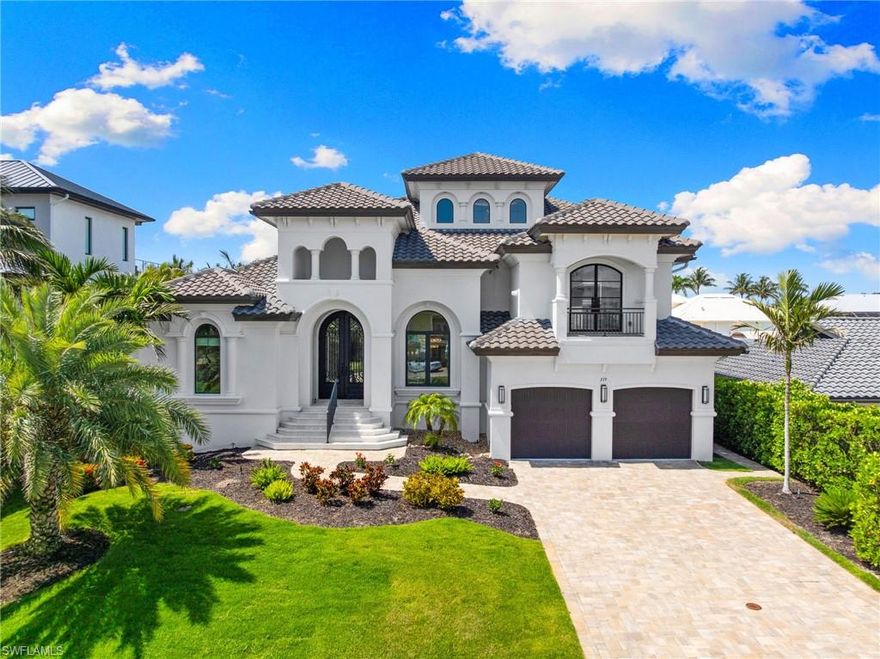 Experience the epitome of waterfront living in this exquisite 2020 custom-built home located in the prestigious Conners community of North Naples. This modern masterpiece combines unparalleled elegance with contemporary design elements and high-end finishes, creating a harmonious blend of comfort and style. 

The open-concept layout allows for seamless integration between indoor and outdoor spaces, making it perfect for entertaining. The expansive kitchen features custom countertops and flows effortlessly into the living areas. With four generously sized en-suite bedrooms, there is ample space for guests and family alike. The upper level boasts additional flex space, ideal for a home office or gym, catering to your lifestyle needs.

Nestled along a canal with direct access to the Gulf of Mexico, this property includes a private boat dock and lift, making it a haven for boating and water enthusiasts. Enjoy sunny Florida days lounging by the sparkling saltwater pool, complete with an outdoor kitchen—perfect for al fresco dining with family and friends.

Rest assured, the living area remained completely dry during recent storms, providing peace of mind in this beautiful location. This exceptional property presents a rare opportunity to claim your own slice of paradise in the vibrant community of Naples, Florida.