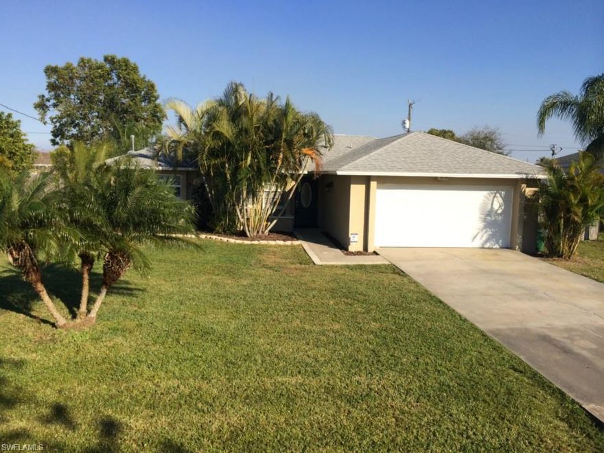 Here's a cute 1116 square foot CBS 3 bedroom, two bath home with a two car attached garage.  The bedroom floors are carpeted; the living room, kitchen and hallways are 24 inch tiles.  The kitchen appliances are stainless steel and the counter tops are Corian.  The back yard is completely enclosed with a six foot privacy fence and contains a paving stone patio.  The plantings around the house included Christmas palms, a rubber tree plant, as well as other trees and palms. (The pinkish cast to some of the photos is a camera thing.  The walls are not pink!)