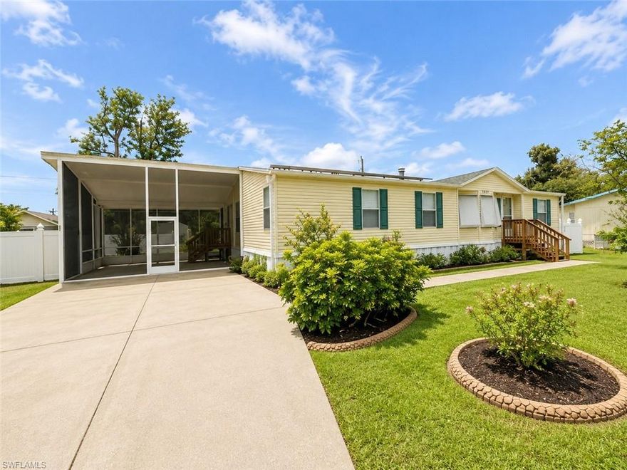 One or more photo(s) has been virtually staged, AI generated or rendered.  Beautifully maintained and truly move in ready, this Suncoast Estates home offers the kind of updates buyers are looking for. Major improvements have already been completed, including a new water softener, washer and dryer, hot water heater, refrigerator, stove, dishwasher, and bathroom vanity. The outdoor living space has been thoughtfully enhanced with a new front porch deck, expanded lanai, and white vinyl privacy fencing, creating the perfect setting to relax, entertain, or enjoy the Florida lifestyle. An RV hookup adds additional flexibility and convenience. Pride of ownership is evident throughout, making this an excellent opportunity for buyers seeking a well cared for home without a long list of projects waiting after closing. Conveniently located with easy access to shopping, dining, Gulf beaches, and Southwest Florida International Airport (RSW), making travel simple for both full time and seasonal residents. Don't miss your opportunity to own this well maintained Suncoast Estates home.