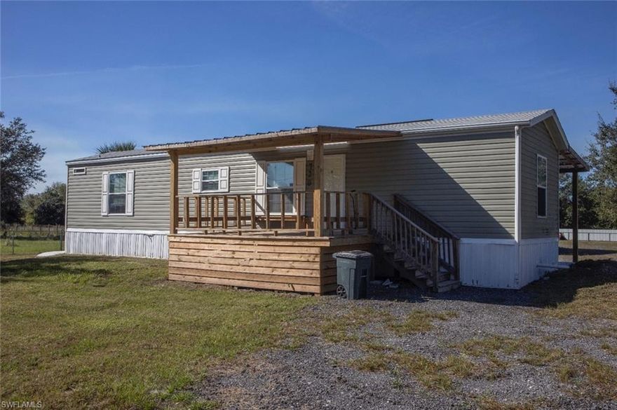 Charming property located in a peaceful area of Clewiston, Florida, perfect for those seeking privacy and country living. This cozy 2-bedroom, 2-bath home features a modern open layout, bright interiors, wood-style laminate flooring, and a fully equipped kitchen with stainless steel appliances.

The lot is fully fenced, offering plenty of space for pets, RVs, or agricultural use. Includes a large enclosed metal workshop/garage ideal for storage or projects.

The home has well water and septic system, with no HOA or restrictions.
Enjoy the best of quiet rural living with convenient access to Clewiston’s shops, dining, and schools.