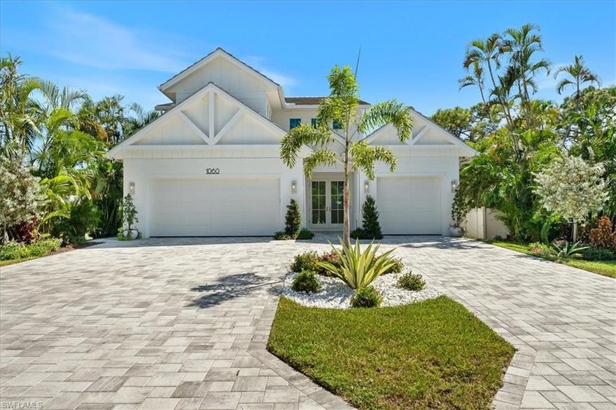 SELLER FINANCING AVAILABLE! BRAND NEW single family home with large 3 car garage, pool, spa, sundeck, Southern exposure, Artisan outdoor kitchen, and over 4,000 sq ft within 1.5 miles to Park Shore beach! This 5 bedroom plus flex/den/loft upstairs, 4.5 bath home has all of the high end finishes you would expect. 48" Sub-zero refrigerator, 48" Wolf Gas cooktop, 46" sink with 2 faucets, double oven, marble tops throughout, custom commercial grade hood, European white oak engineered hardwood, buried gas tank, porcelenosa tile, Stormsmart Screens, motorized shades in living and primary suite, and gorgeous custom designed marble fireplace walls. You will have a hard time deciding where to entertain between your two story volume living area, your outdoor living area with 86" TV wall with gas fireplace, or your upstairs living room with full wet bar. This home has been professionally staged with Caracole furniture and a package can be purchased separate from the home. Every closet in the home has been finished out so you can just bring your toothbrush and move in! The oversized primary closet has been built out and can be modified as needed for the buyer! Don't miss out on this home close to EVERYTHING Paradise has to offer!