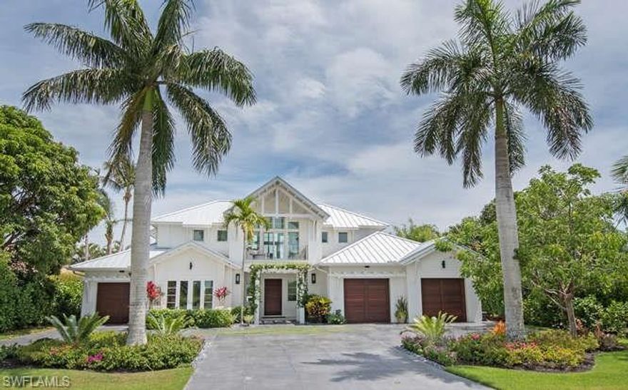 JUST REDUCED $865,000 AND PRICED TO SELL! ABSOLUTELY STUNNING HOME WITH ONE OF A KIND UPGRADES. Designed by MHK Architects, this luxury residence boasts over 4,300 square feet, three bedrooms and 4.5 bathrooms. The open design and contemporary elements provide easy and stunning Florida living.  Offering open concept living, well-appointed chef’s kitchen, enviable outdoors space, spacious master retreat, generous additional guest rooms, and the latest in tech and conveniences, this residence is truly spectacular.  Enter through the custom front door to the formal foyer and living room.  All seamlessly integrated with the eat-in kitchen, family room, and two covered lanais. The line between indoor and outdoor living is delightfully blurry in this well-designed home.  The outdoor space which offers outdoor living with a sparkling pool, spa, outdoor kitchen, seating and dining areas is the centerpiece of the home.  Take a refreshing dip in the salt water pool in the privacy of your completely fenced in oasis or gather around the one-of-a-kind custom fireplace feature.  No detail was overlooked in the creation of this luxurious Naples retreat.