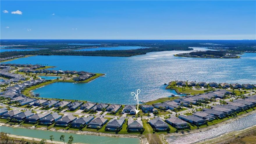 Discover refined luxury in this one-of-a-kind 3,178 sq. ft. 4-bedroom, 4-full bath estate home, in WildBlue. This residence is the best-selling Baneberry floorplan and has been highly upgraded post-closing with no detail overlooked. Featuring 12-foot ceilings with stunning architectural elements, redesigned kitchen with barrel-ceiling detail, new custom cabinetry, appliances and 14-foot waterfall-edge quartz center island.  The gracious living area features a custom built-in wall feature and beamed-ceiling design. The owner’s added an additional full bathroom creating 4 en suite bedrooms. The spacious, reimagined floorplan offers the perfect balance of space, privacy, and modern livability. The seamless indoor-outdoor connection leads to an oasis on the lanai with living area, outdoor kitchen with gas grill, modern saltwater pool with striking waterfall feature, and newly completed upgraded landscaping with professional lighting.  Enjoy diner al fresco in the outdoor dining area then relax in the Florida breeze in the ambiance of the outdoor living room with linear natural gas fireplace while entertaining friends and family. No detail has been overlooked in the $300,000+ in upgrades showcased throughout.  Rest easy with impact windows and doors, whole home natural gas generator, and air-conditioned 3-car garage. WildBlue offers resort-style amenities, including two pools, a private clubhouse, with open-air bar, multiple dining options, fitness center, tennis, pickleball, and boat launch for kayaking, motor boating, or jet skiing on the lake. This home is offered fully furnished ready for the discerning buyer to begin immediate enjoyment of this ultimate luxury lifestyle!