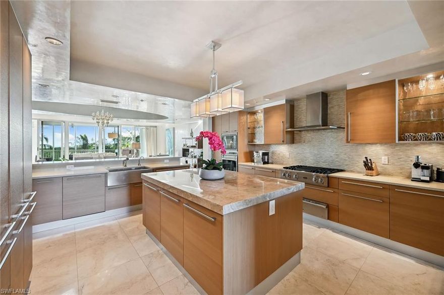 Welcome to the rarely available waterfront retreat at Unit 508 in the prestigious Aqua building. This exquisite residence invites you into a world of design-inspired elegance and sophistication. This unit is one of the best floor plans in the Aqua building. With three beds, 3.5 baths it's one of the largest condominiums with a view in Naples for the price! The interior boasts a design-inspired decor that harmonizes seamlessly with serene coastal surroundings. Custom paint throughout the space creates an inviting ambiance. Complete with Viking and Wolf Appliances, a 2.5-inch-thick quartzite island, marble flooring, butler’s pantry, family room and living room, private elevator entrance, beautiful views with two balconies on either side, and a large dual bath, this is a rare gem and entertainer’s dream. The Aqua building itself is a testament to architectural brilliance and offers an array of amenities that complement the upscale lifestyle, including a ferry to and from the beach from Pelican Isle Yacht Club, boat slips, cabanas, a resort pool and grill, theater room, club room, golf simulator and game room, guest suites for guests, two dog fields and a fitness center.