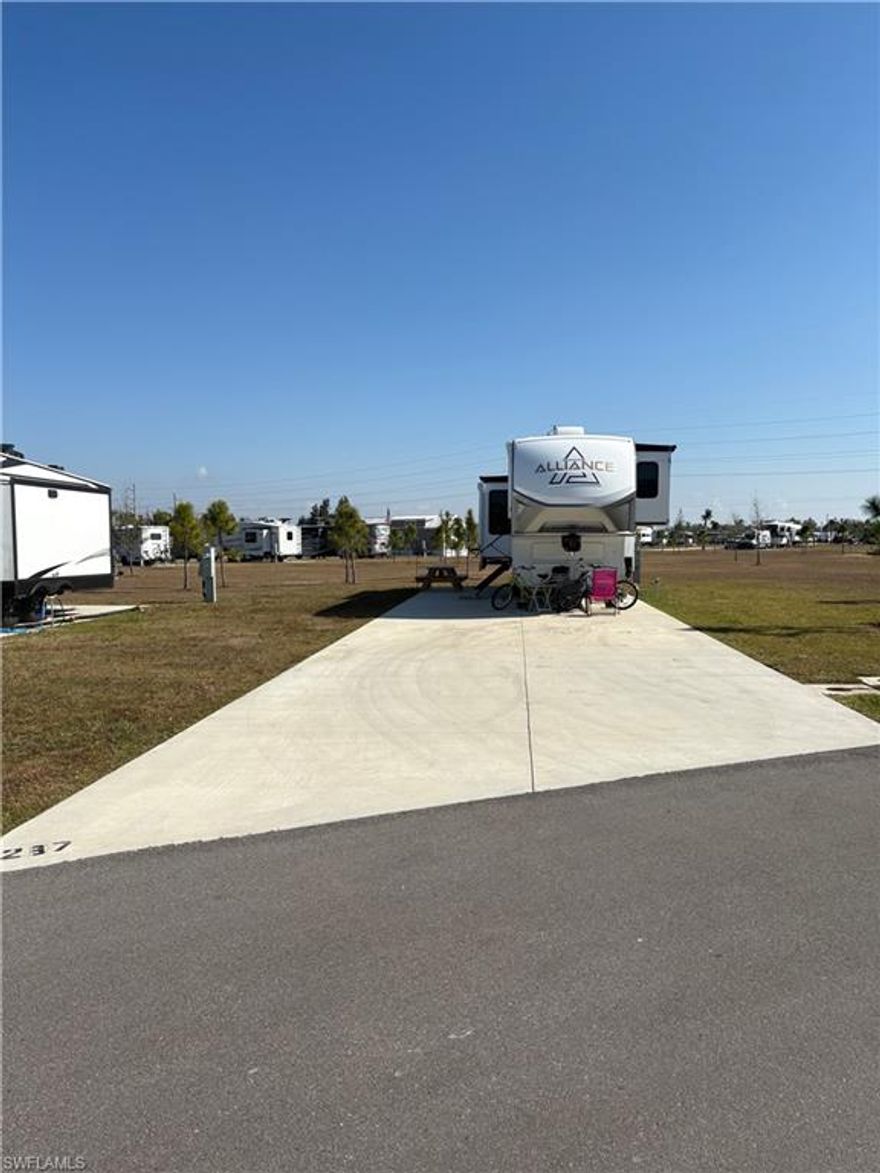 Welcome to Lot 237 at Palm Breeze RV Resort, where it’s truly all about location, location, location!

Ideally situated just steps from the resort’s premier amenities and clubhouse, this homesite offers unmatched convenience while still providing an open, spacious feel. Enjoy being close to the heart of the community — pool, gathering spaces, and activities — without sacrificing privacy.

Surrounded by beautiful green space, Lot 237 feels light, open, and inviting. The extra breathing room enhances your outdoor living possibilities, whether you envision a tiki hut, outdoor kitchen, lush landscaping, or a serene seating area to enjoy Southwest Florida’s sunshine.

Palm Breeze RV Resort delivers elevated resort-style living in a prime Punta Gorda location, just minutes from Punta Gorda Airport, I-75, shopping, dining, and waterfront attractions. Whether you’re seeking a seasonal retreat or a long-term investment in one of Southwest Florida’s most exciting new luxury RV communities, Lot 237 offers the ideal blend of convenience, community, and lifestyle.

Come experience why this location stands out — Lot 237 is positioned perfectly for both relaxation and connection.