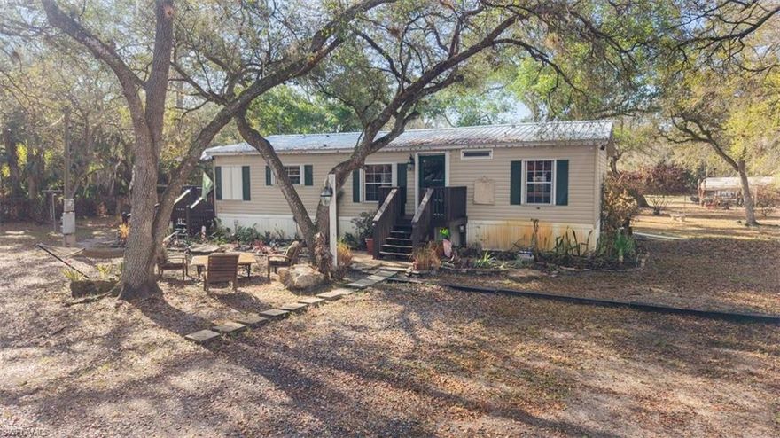 Beautifully wooded 2.5 fenced acres with three bedroom two bath home with metal roof and custom kitchen. Very well maintained move in ready home.