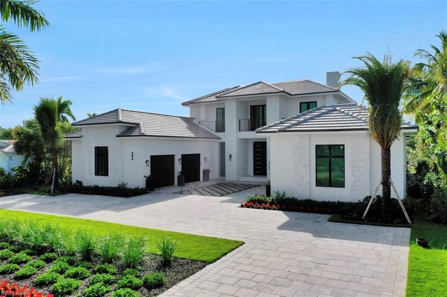 Experience Luxury, Paradise Living at its best from this unparalleled Location, Within
The heart of Old Naples. Enjoy Beautiful Naples Beach Club Golf Course views from the front terrace, Walk to the beach, & Bike to 5th & 3rd Avenue. From the moment you walk through the door you are taken by the Grand, Open Layout & Gorgeous View of the Exceptional Outdoor Living space. This Modern, Coastal Inspired home boasts 4 en suite bedrooms + Den, with over 4600 sq ft.R. G. Designs created this two story, Free Flowing floor plan which affords effortless entertaining along with A 400 bottle Wine Cellar attached to the L shaped Wet Bar. The Chef’s inspired Kitchen ( Wolfe & Sub zero Appliances) opens seamlessly to great room, Dining Area, & Incredible, Oversized,  Outdoor Living Area. The Private Tropical Oasis offers Southern Exposure, Lush with beautiful landscaping, Large Sunning deck, Exquisite Pool/ Spa & Fire Feature, Covered Entertaining Space for Grilling, Dining & Relaxing by the fireplace.  3 car garage with Impressive, Spacious Circle Drive way.