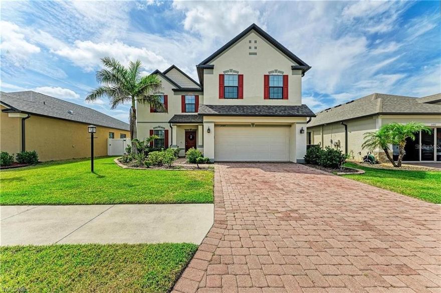 Welcome to Villa Milano – a beautiful gated, pet-friendly community perfect for you and your family. This meticulously maintained 5-bedroom, 3-bathroom home, built in 2017, offers both comfort and character with thoughtful design elements ideal for extended family or guests. The home features numerous upgrades and charming architectural details throughout, including decorative wall accents and elegant tray ceilings that add a touch of sophistication to every room. Warm natural light flows through the open-concept floorplan, which is enhanced by wood-look tile flooring that combines style with durability. The main level offers five rooms, providing plenty of space for entertaining and accommodating guests. At the front of the home, a versatile bonus room with traditional panel wainscoting can serve as a formal dining room, office, or cozy sitting area. The first of the home’s five bedrooms is also on the main floor and includes a walk-in closet, offering privacy and comfort for visiting friends or family. The spacious living area is designed for both relaxation and gatherings, featuring a wood accent wall and ample room for a dining setup. The chef’s kitchen is equipped with stainless steel appliances, real wood cabinetry, a custom tile backsplash, a large breakfast island, and an ample pantry—making it the perfect space to entertain. Upstairs, you’ll find a cozy loft ideal for a secondary living space or media room. The split-bedroom layout ensures privacy for the homeowners, with the primary suite tucked away as a peaceful retreat. It features high tray ceilings, a generous walk-in closet, and a luxurious ensuite bathroom complete with dual sinks, a large walk-in shower, and a freestanding soaking tub. Three additional spacious bedrooms and a full bathroom complete the upper level. Step outside to enjoy the large open lanai and fenced backyard—ideal for relaxing or spending time with family and friends. Additional features of the home include an interior laundry room, a two-car garage with overhead storage racks, a newer roof, paver driveway and walkways, and access to public water and sewer. Residents of Villa Milano enjoy access to a lovely clubhouse and community pool, just a short walk from the home. Conveniently located near parks, shopping, dining, and entertainment, you’ll also be just a short drive away from the beautiful beaches of Manasota Key and Boca Grande. This move-in-ready home has everything you need—schedule your showing today!