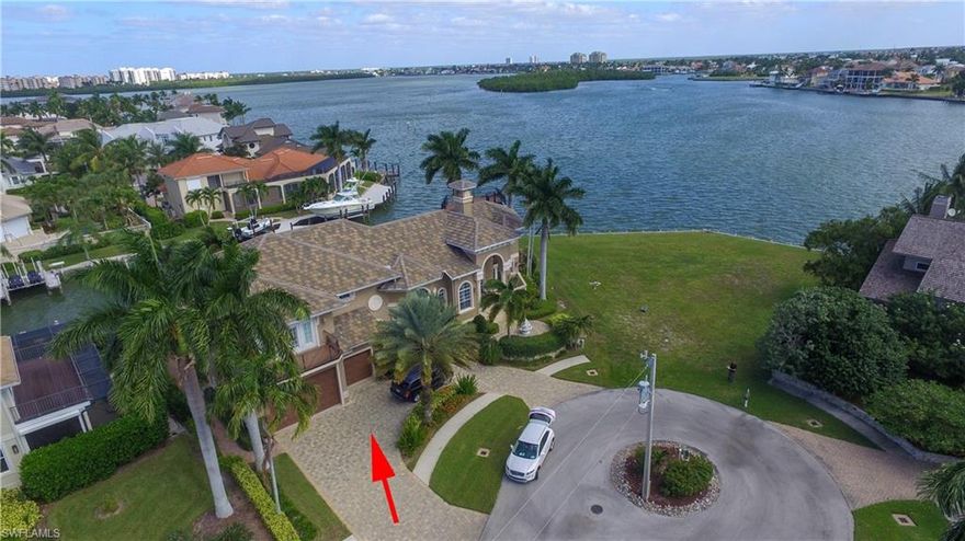 Direct access to the Gulf. 150 ft of waterfront! This 5 bedroom plus den/7 bath single-family home offers unobstructed views of Collier Bay, also enjoy watching dolphins, manatees, and pelicans all day while relaxing on the dock or in the heated infinity-edge spa pool. This home has a 2018 roof with all decks replaced recently, it also has updated hurricane protection with upgraded Hurricane Glass and accordions shutters, Custom kitchen and upgraded appliances, home theater room equipped with a fridge, and microwave. Also; you can dine on the outdoor patio poolside that features a summer kitchen and fire pit. This home boasts of a home office, security system, a 2,000 SQ.FT. dock with multiple lifts, plenty of dock space for your boats, sailboat, and jet skis. Conveniently located to Marco beaches, unique shopping venues, and distinctive restaurants, this home is just the place to relax in the sun and enjoy the fantastic views!